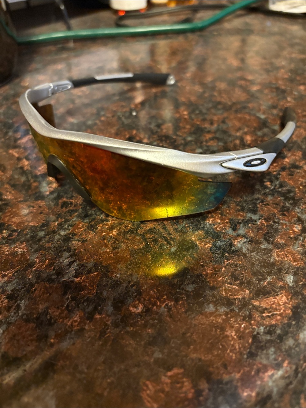 Oakley Silver Frame Sunglasses with Amber Mirrored Lens